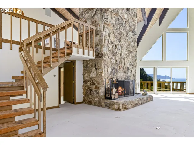 a view of an empty room with a fireplace