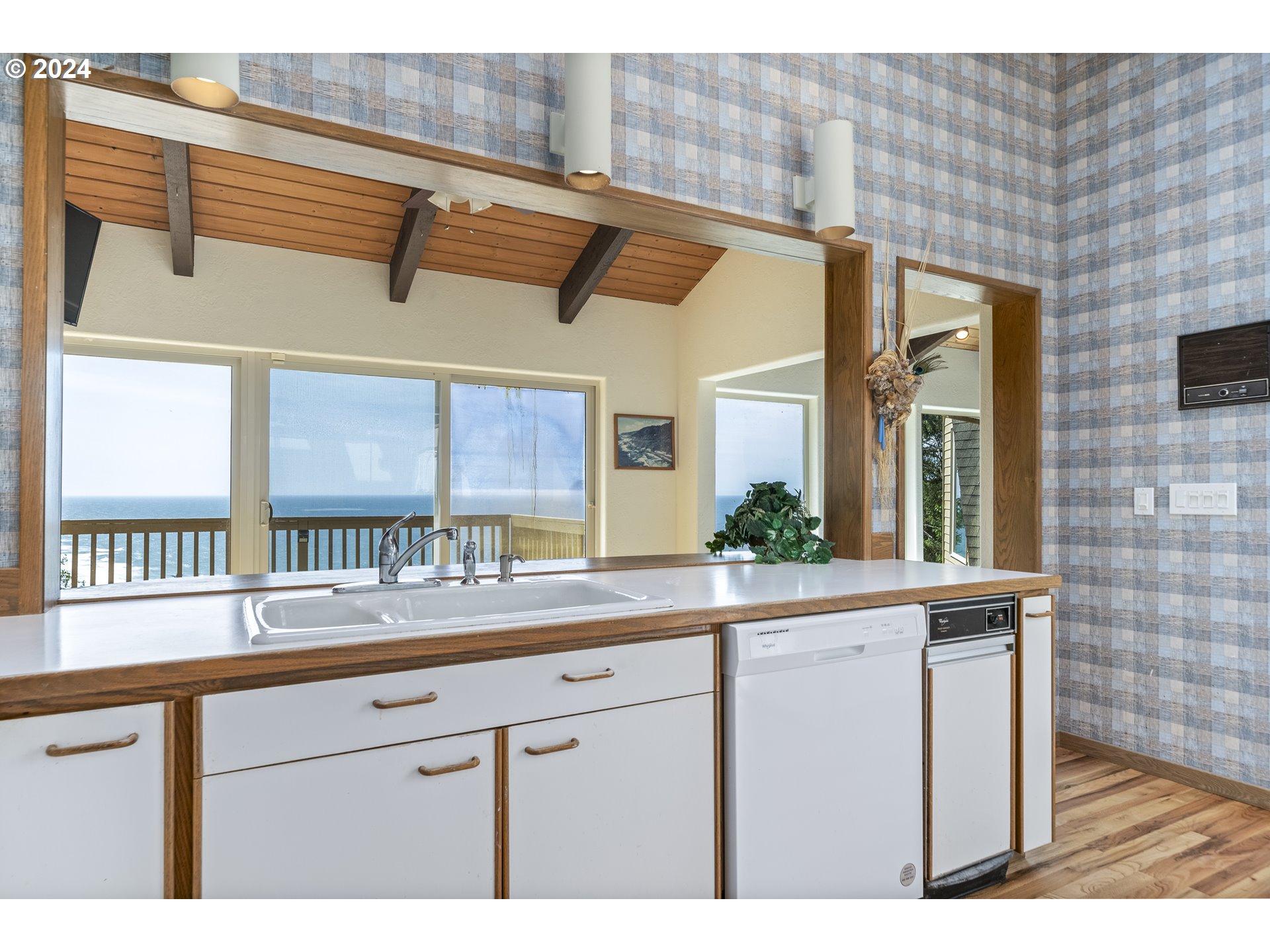 94515 Highway 101 Yachats, OR 97498 - Photo 17 of 45 a kitchen with a sink and a window