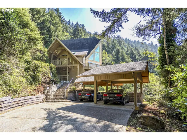 a view of a house with a cars park