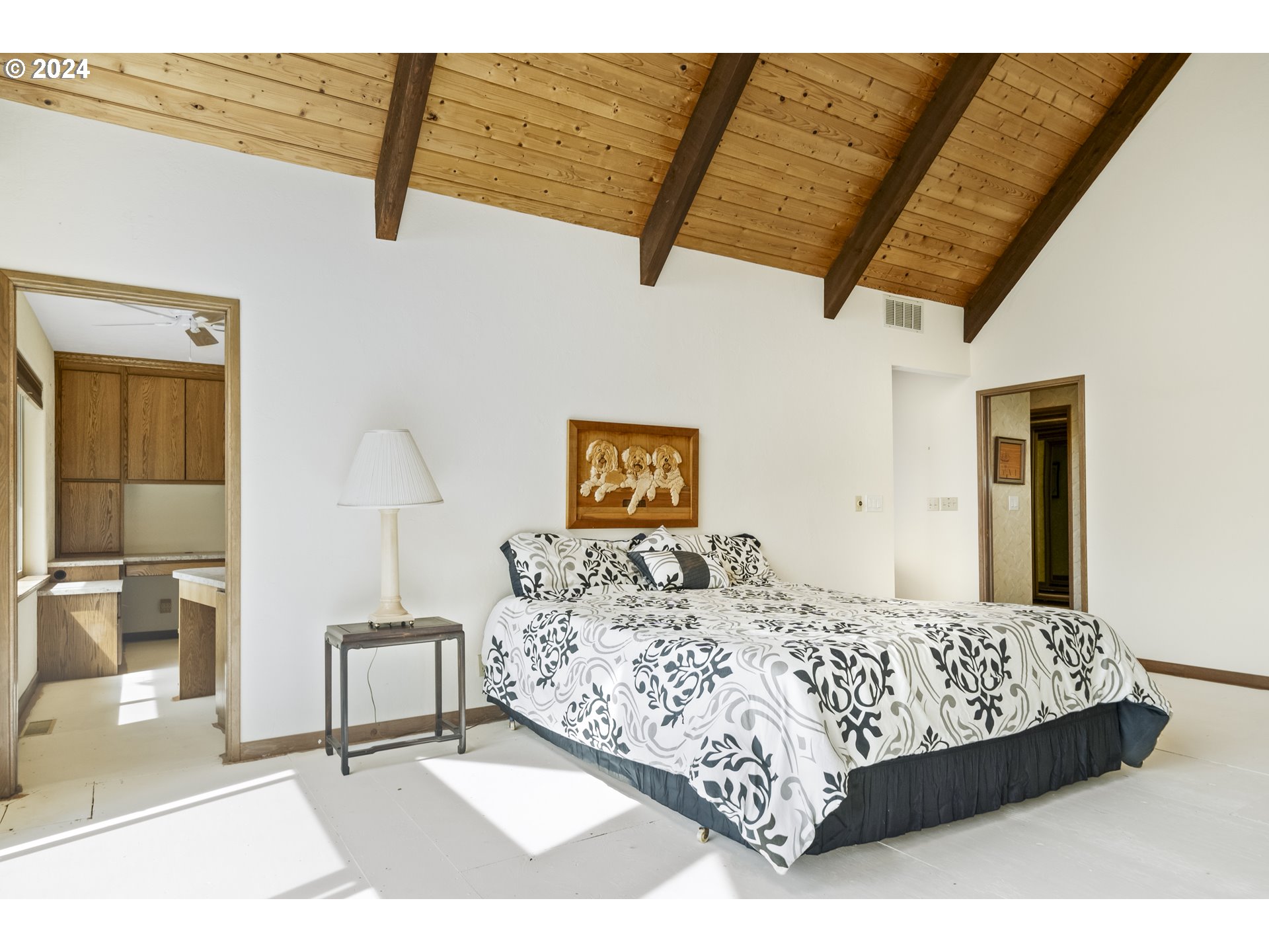 94515 Highway 101 Yachats, OR 97498 - Photo 25 of 45 a bedroom with a bed and a walk in closet