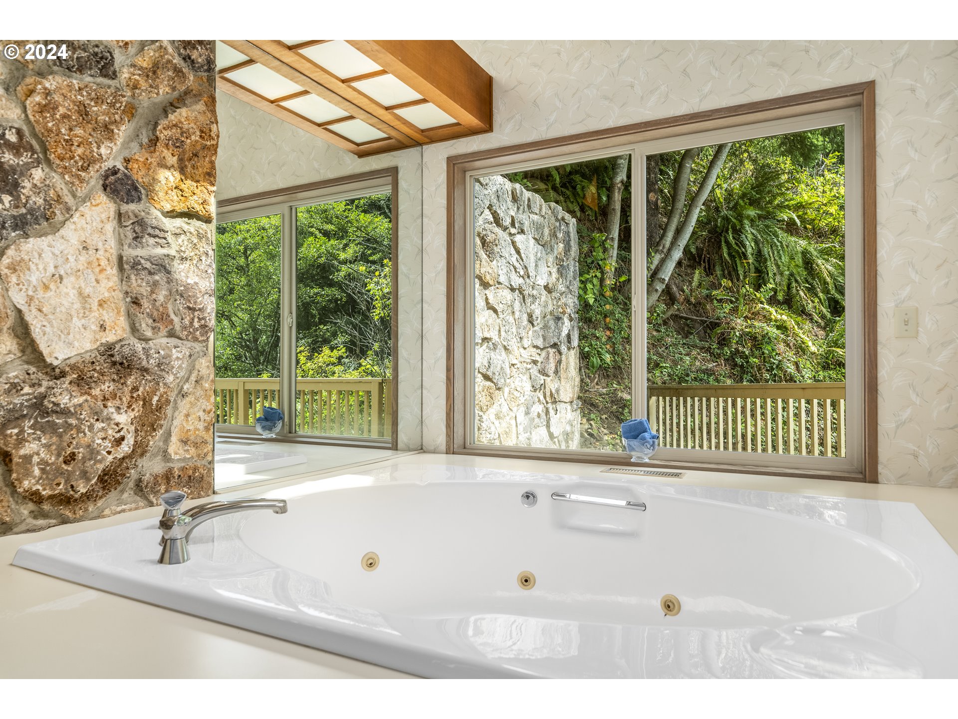 94515 Highway 101 Yachats, OR 97498 - Photo 26 of 45 a bathroom with a bathtub and next to a window