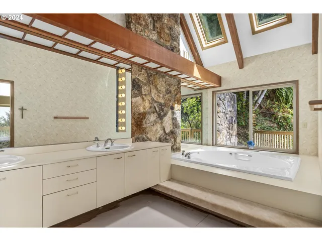 a bathroom with a sink and mirror