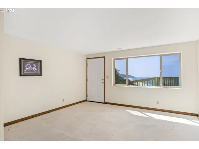 a view of an empty room with sliding door