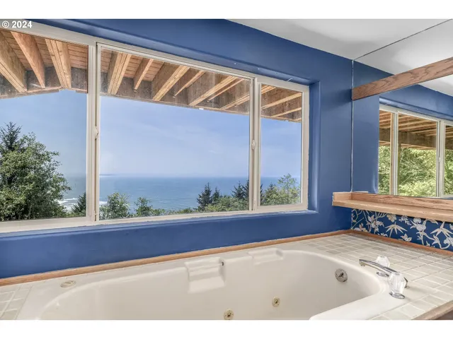 an empty room with floor to ceiling windows