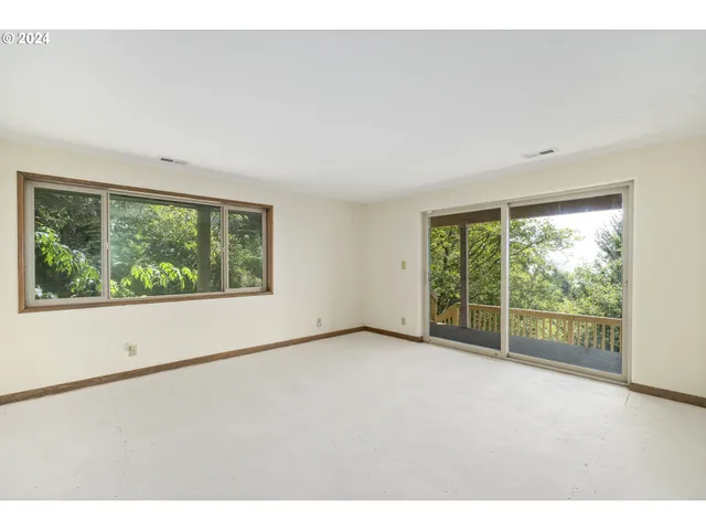 a view of balcony with wooden floor and city view