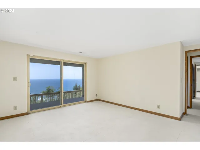 a view of balcony with wooden floor and outdoor seating