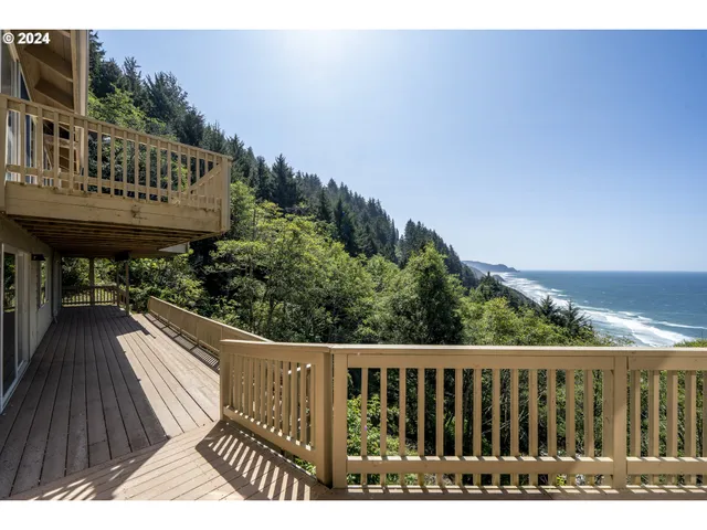 a view of balcony with wooden floor and fence