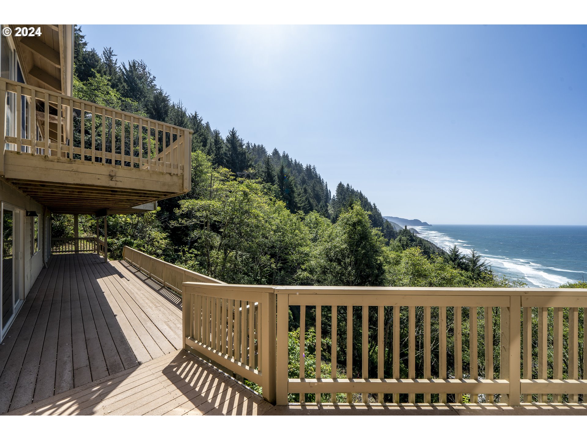 94515 Highway 101 Yachats, OR 97498 - Photo 40 of 45 a view of balcony with wooden floor and outdoor seating