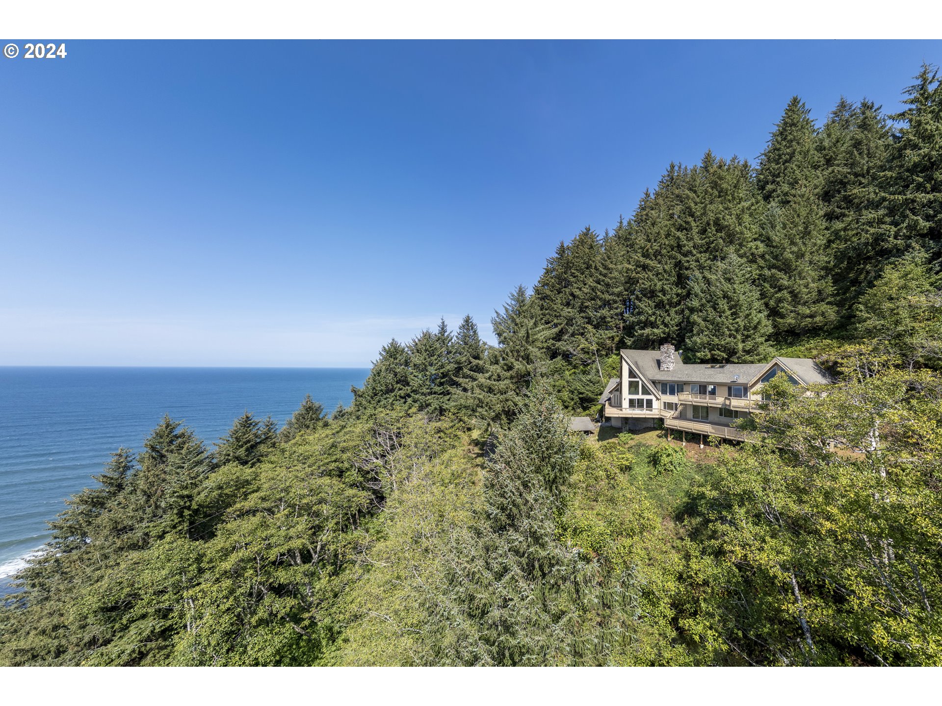 94515 Highway 101 Yachats, OR 97498 - Photo 4 of 45 a backyard of a house with lots of green space
