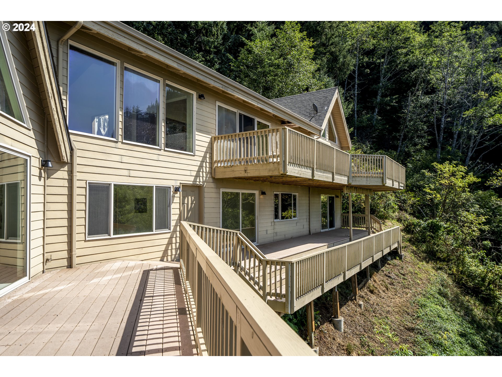 94515 Highway 101 Yachats, OR 97498 - Photo 41 of 45 a view of a house with a deck