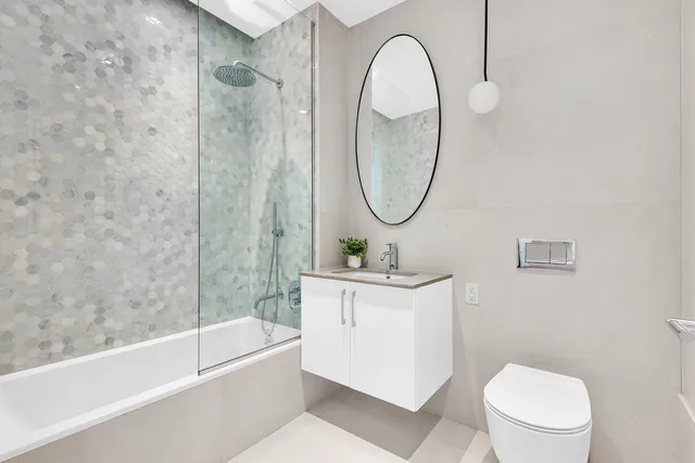 a bathroom with a sink a toilet and a bathtub