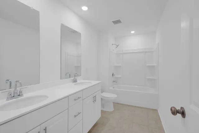 a view of a house with a yard and table and chairs