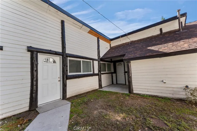 a picture of a bench in front of statue