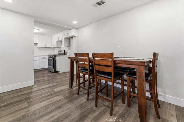 a kitchen with cabinets stainless steel appliances and a sink