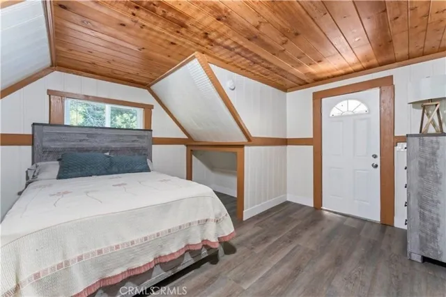 a view of a balcony with wooden fence