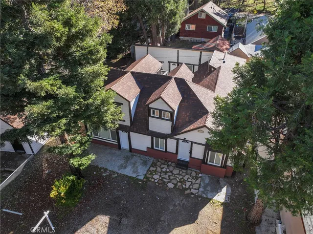 a kitchen with a stove and white cabinets