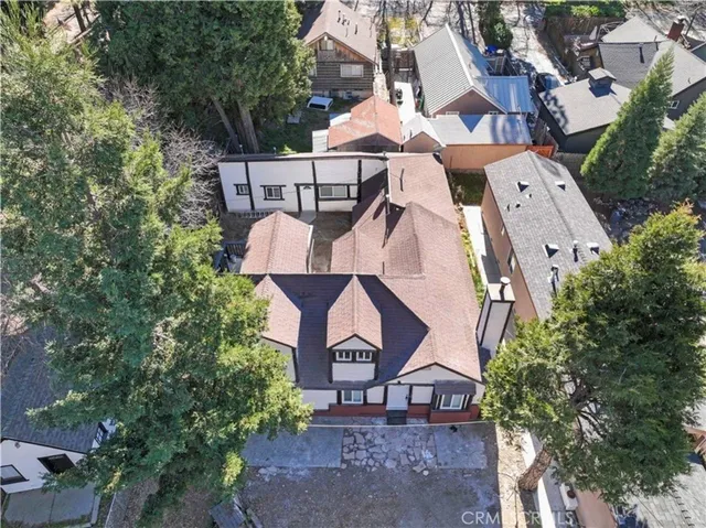 a view of a house with a yard and sitting area