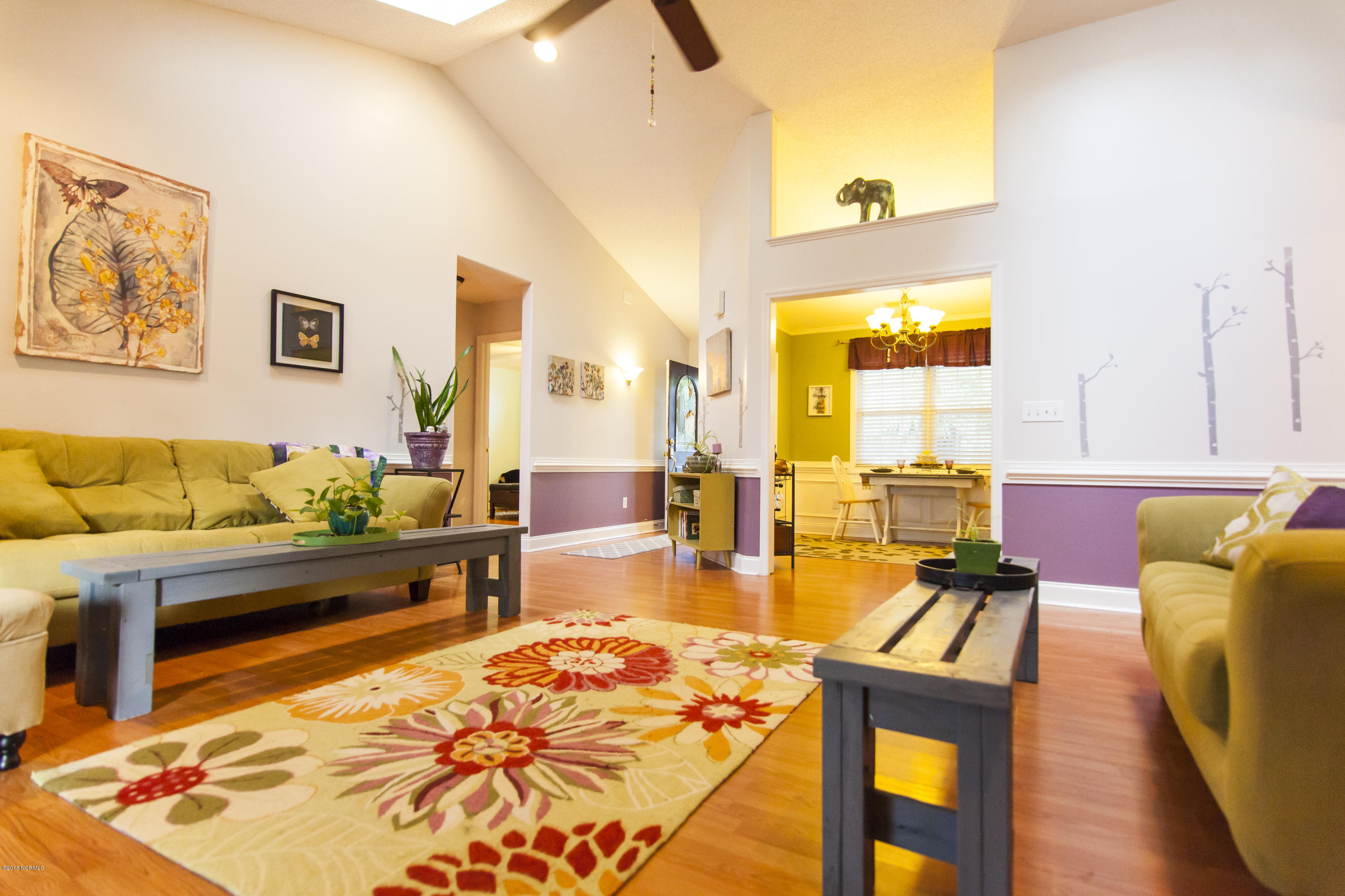 104 Holly Berry Road New Bern, NC 28560 - Photo 19 of 28 Open Living Area With Vaulted Ceilings and Sky Lights
