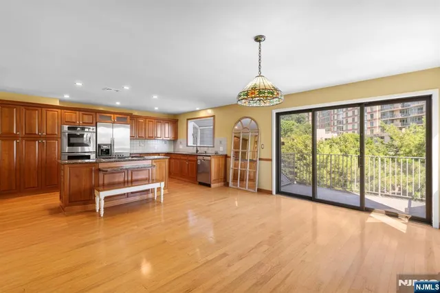 a view of a living room and kitchen with a large window