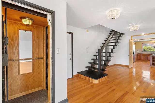 a view of entryway with wooden floor