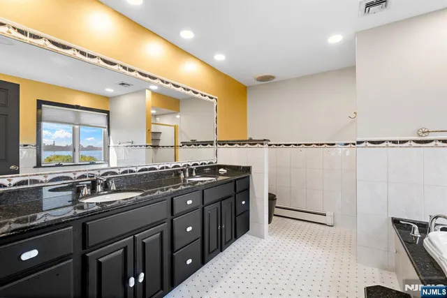 a kitchen with a sink and a stove top oven