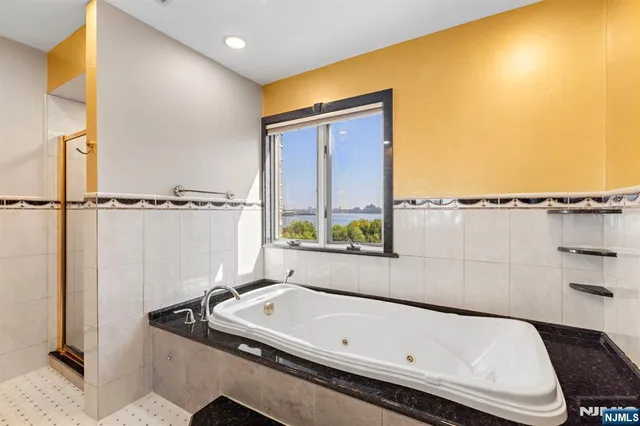 a bathroom with a tub and a sink