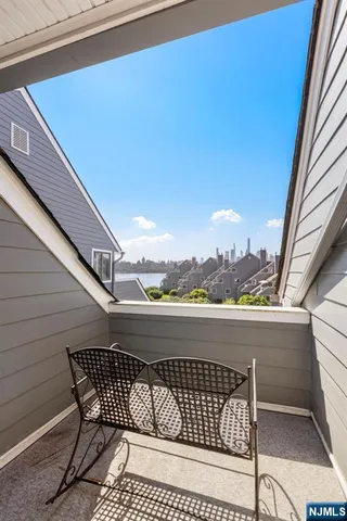 a view of balcony with furniture