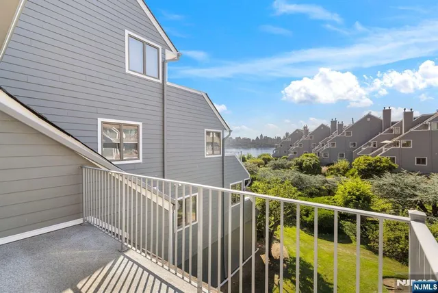 a view of a balcony with two chairs