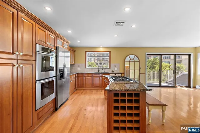a view of kitchen with furniture and large window