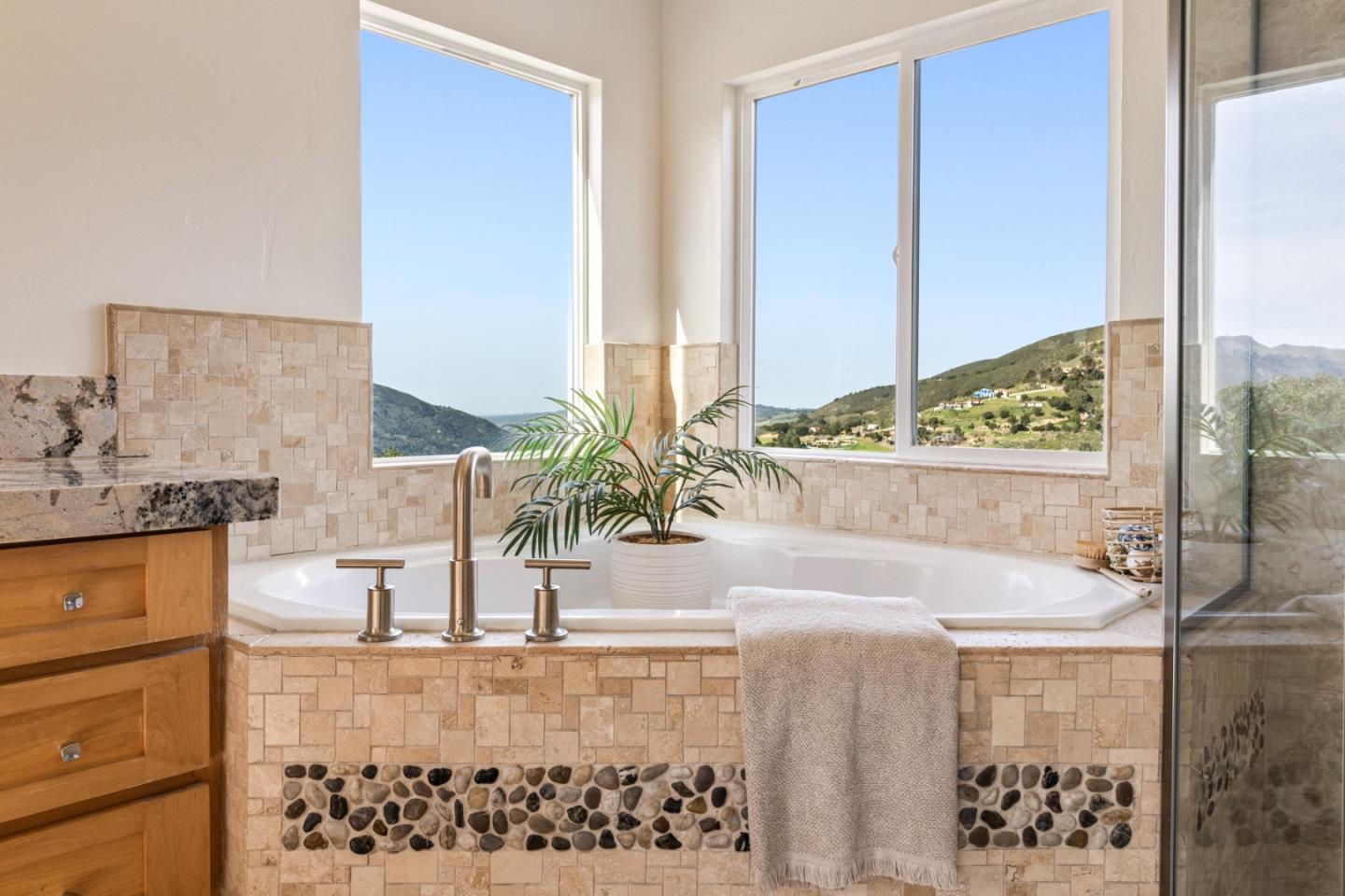 320 El Caminito Road Carmel Valley, CA 93924 - Photo 29 of 62 a bathroom with a bathtub and a sink