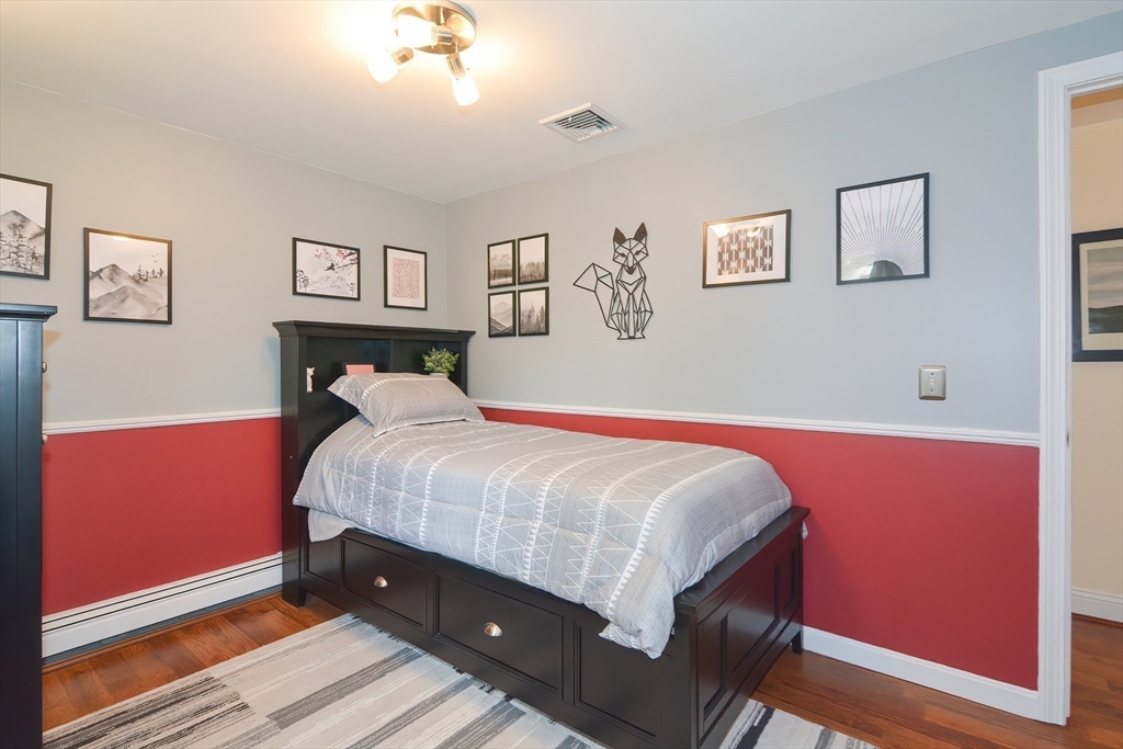 21 Brookside Drive Douglas, MA 01516 - Photo 24 of 38 a bed room with a bed and a desk