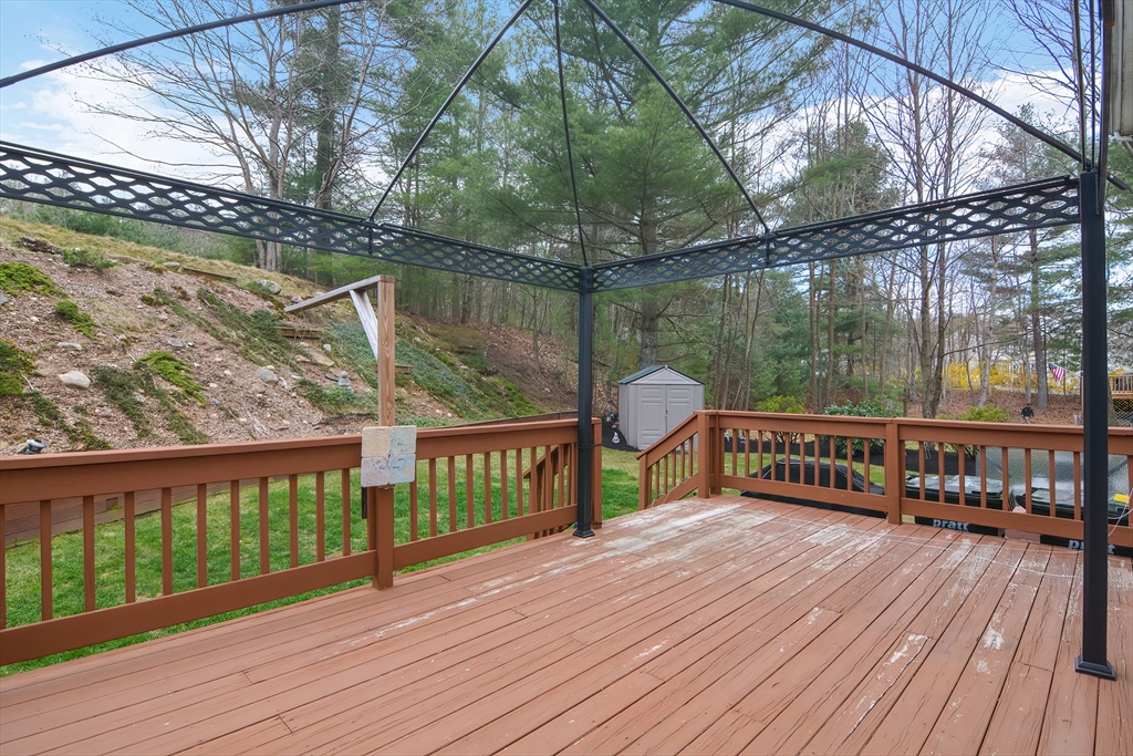 21 Brookside Drive Douglas, MA 01516 - Photo 38 of 38 a view of a wooden deck with a yard