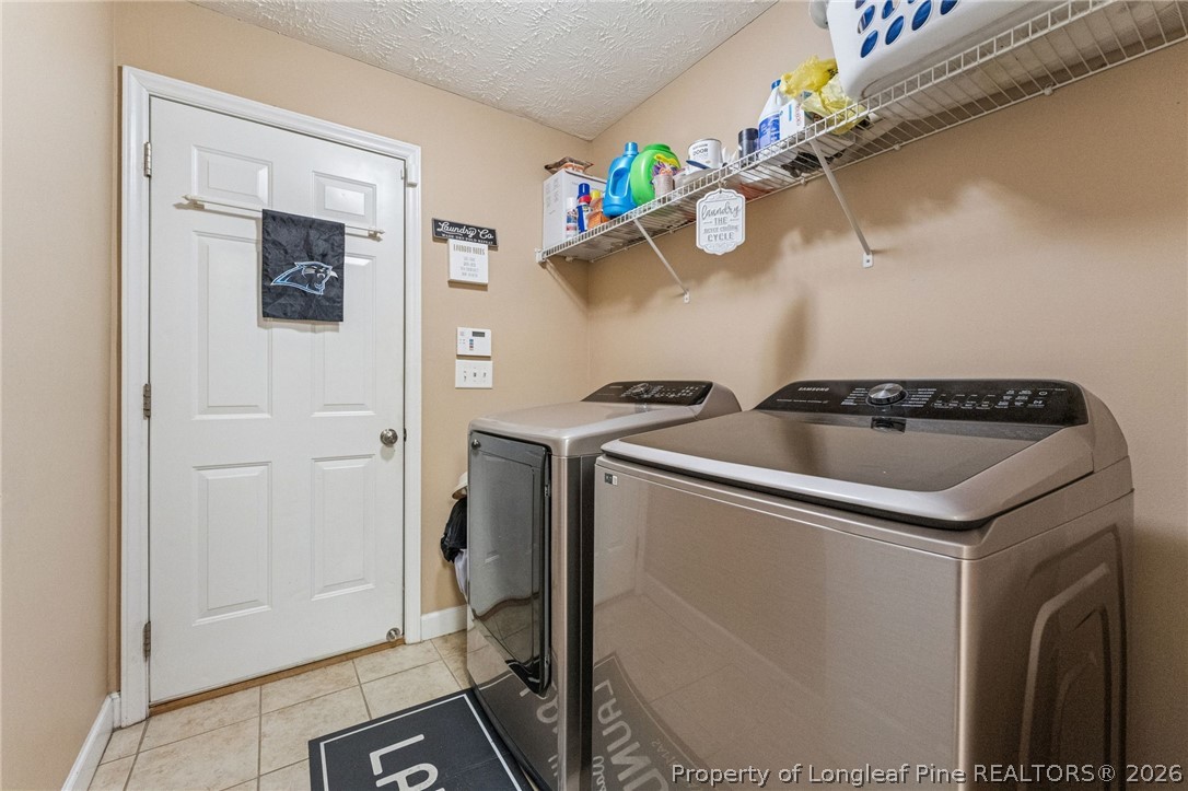 295 Pender Road Spring Lake, NC 28390 - Photo 15 of 30 a kitchen with a refrigerator and a stove