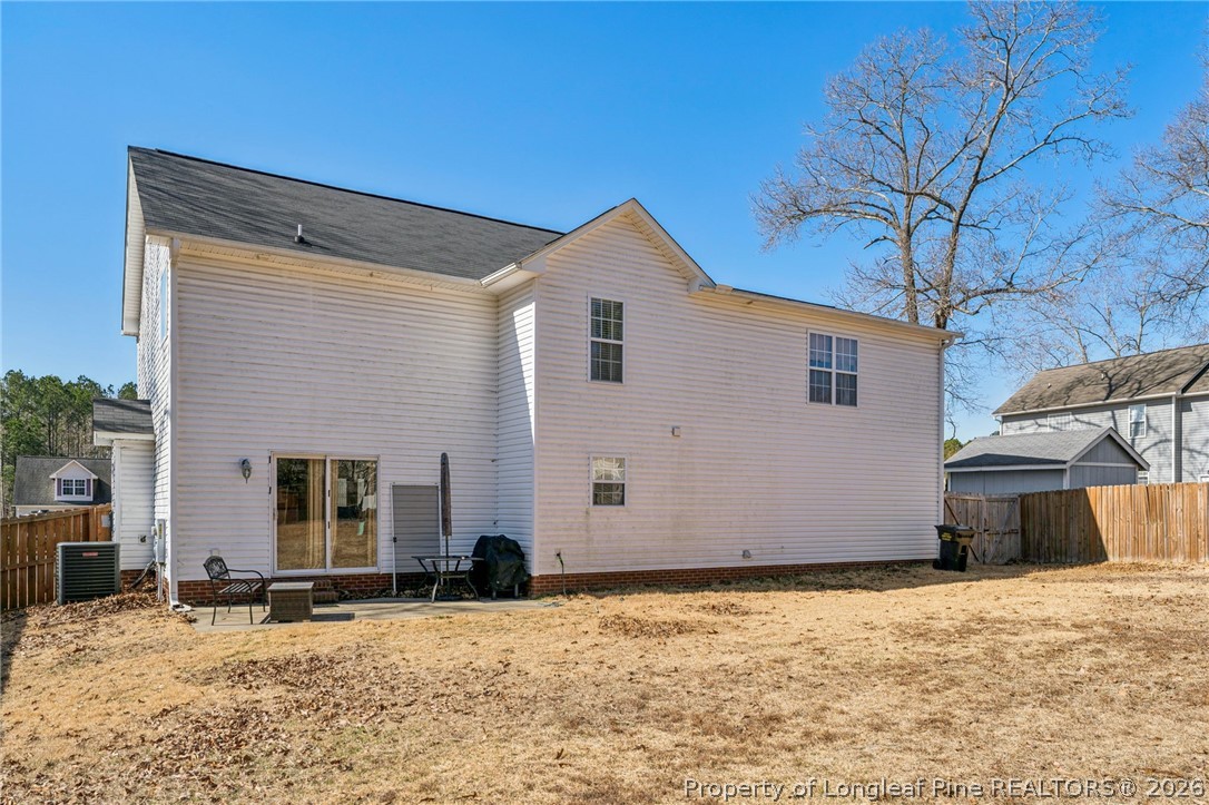 295 Pender Road Spring Lake, NC 28390 - Photo 5 of 30 a front view of a house with a yard