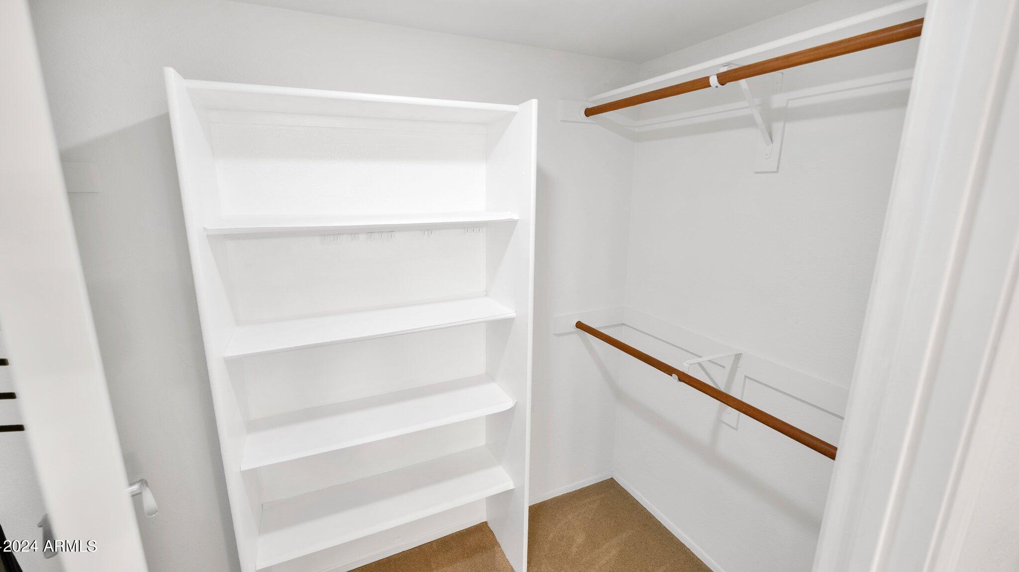 9990 North Scottsdale Road, Unit 1019 Paradise Valley, AZ 85253 - Photo 21 of 30 a view of walk in closet with empty racks