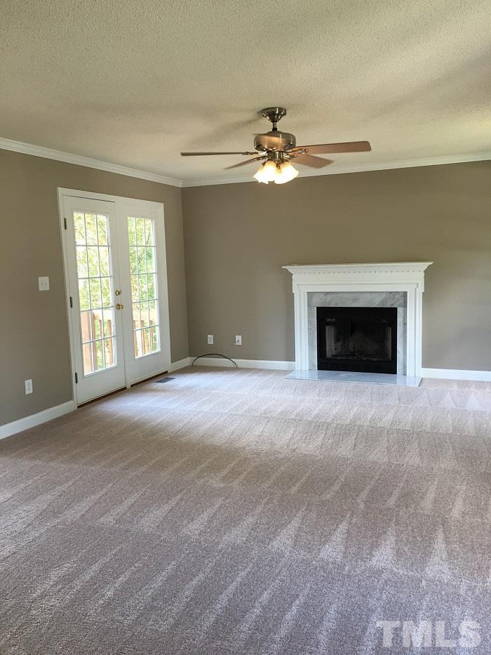 4100 Landrum Lane Raleigh, NC 27616 - Photo 2 of 12 a view of empty room with a fireplace