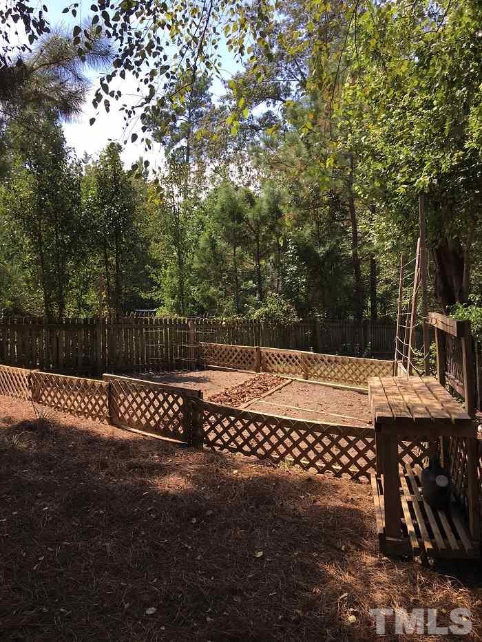 4100 Landrum Lane Raleigh, NC 27616 - Photo 8 of 12 a view of a wooden fence