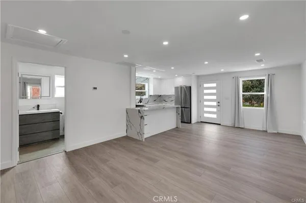 a view of a kitchen with a sink and a stove top oven