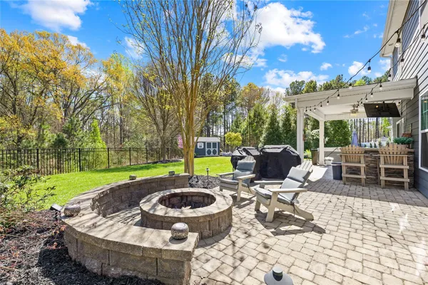 a view of a backyard with sitting area