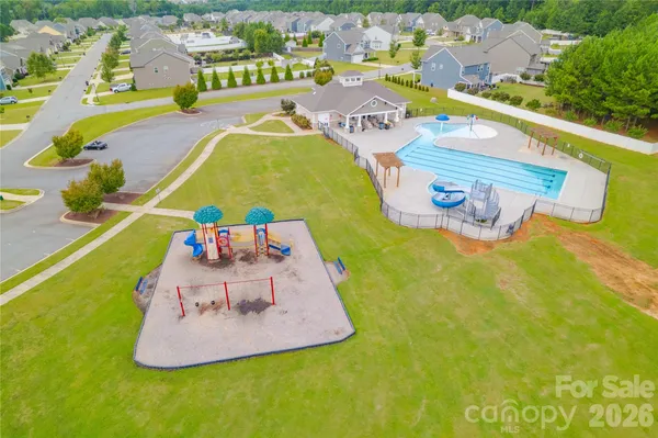 a view of a swimming pool with a garden