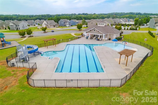 swimming pool view with a outdoor seating