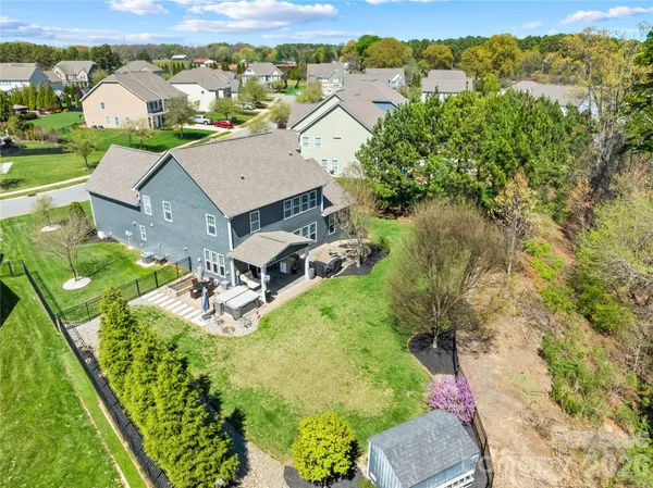an aerial view of residential houses with outdoor space