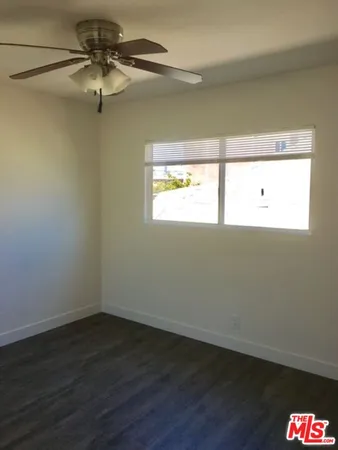 a view of an empty room and a window