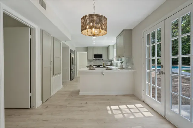 a view of a hallway with seating area