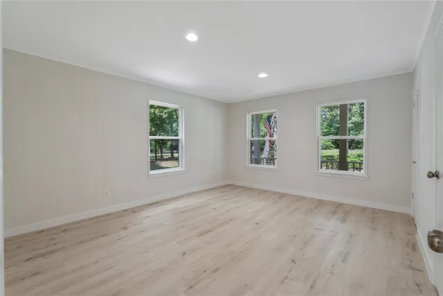 a bathroom with a granite countertop toilet sink and a mirror