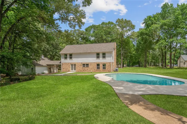 a view of outdoor space yard swimming pool and green space