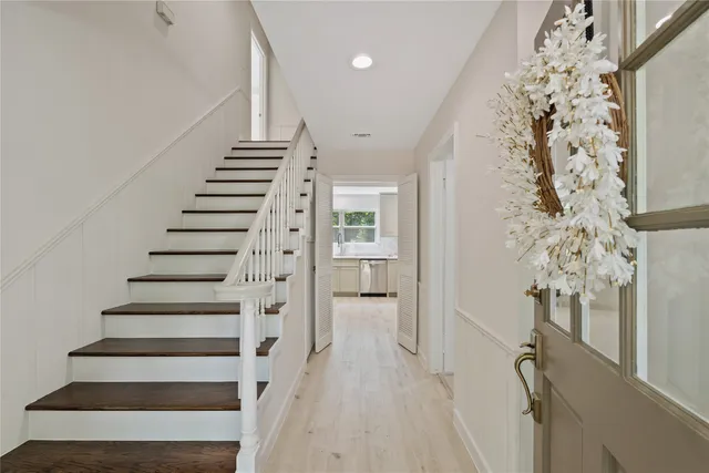 a view of entryway with wooden floor