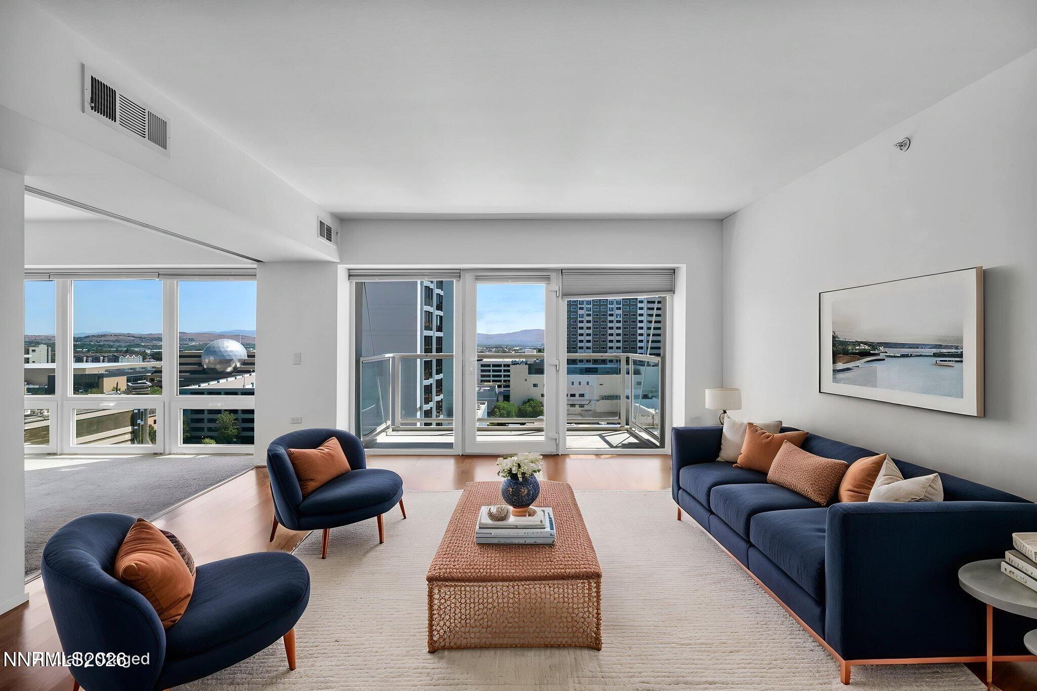 255 North Sierra Street, Unit 1208 Reno, NV 89501 - Photo 2 of 37 a living room with furniture and floor to ceiling windows