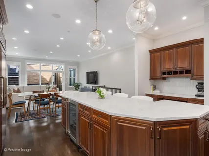 a kitchen with a table chairs stove and microwave