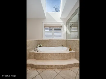 a bathroom with a bathtub and a sink